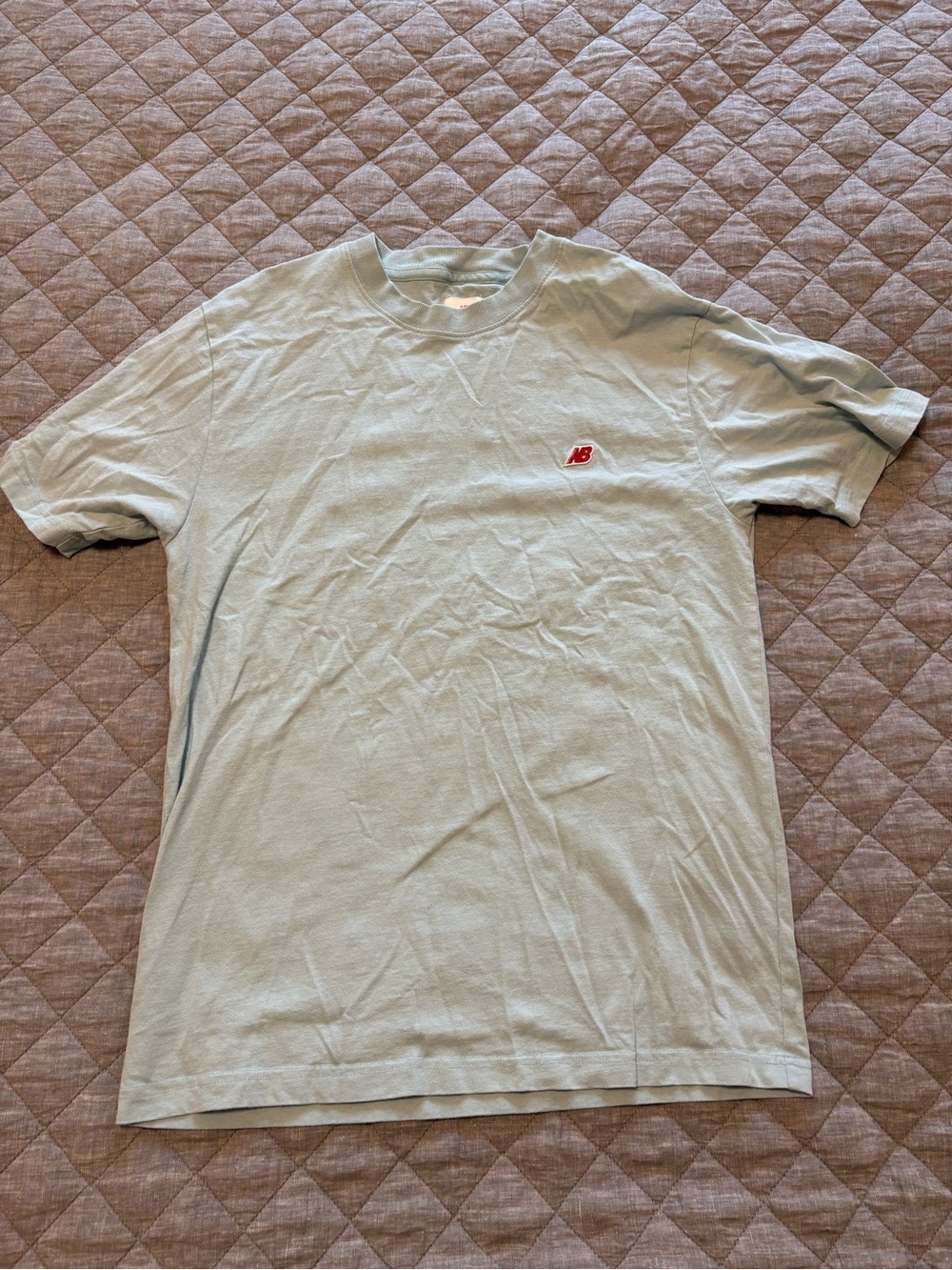 New Balance Pale Blue Short Sleeve Tee with Red NB Emblem
